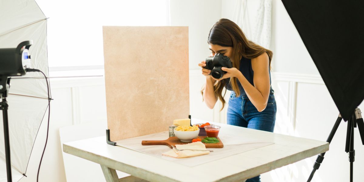 A professional photographer uses advertising photography to create picture-perfect product photos for a marketing strategy.