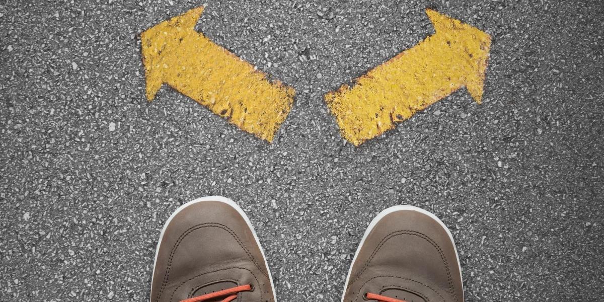 A crossroads illustrating the choice between custom built websites vs. templates | THAT Agency of West Palm Beach, FL